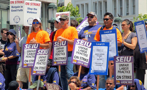 Striking rapid transit, city workers rally in Oakland, Calif.