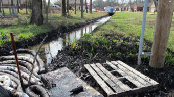 Arkansas oil spill paints town black, pipeline risks exposed