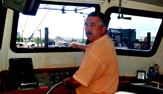 A shrimp boat captain worries and waits