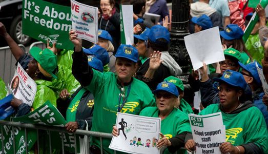 NYC public workers battle Bloomberg, with video