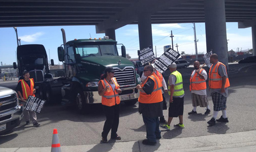 Port drivers out on strike, demand companies follow law