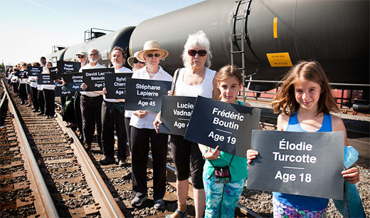 Vigil held for explosion victims as criticism of oil trains broadens