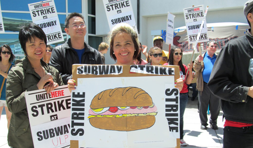 Oakland Airport concession workers strike for a day