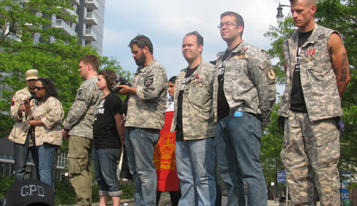 Iraq and Afghanistan veterans return medals at NATO protest