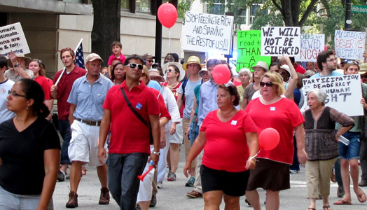 Thousands rally at N.C. Moral Monday vowing “silence never again.”