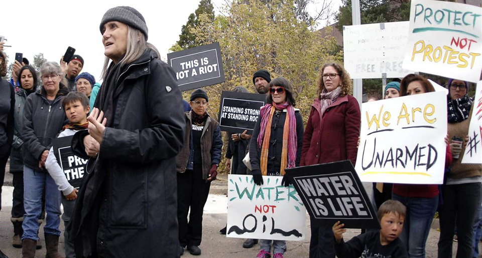 Amy Goodman riot charge dismissed, others still endangered