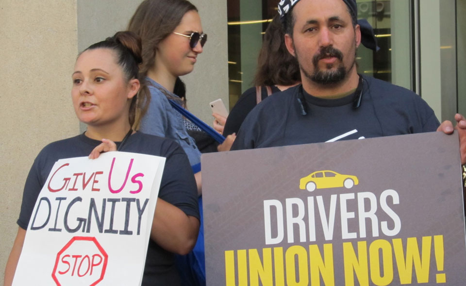 Uber and Lyft drivers demand their rights as employees