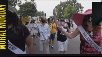 Honoring the suffragists, women in white march for voting rights