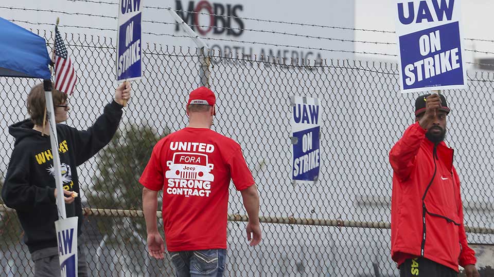 Auto workers expand their nationwide strike to include two more plants