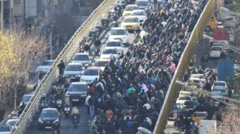 What triggered the latest mass protests in Iran?